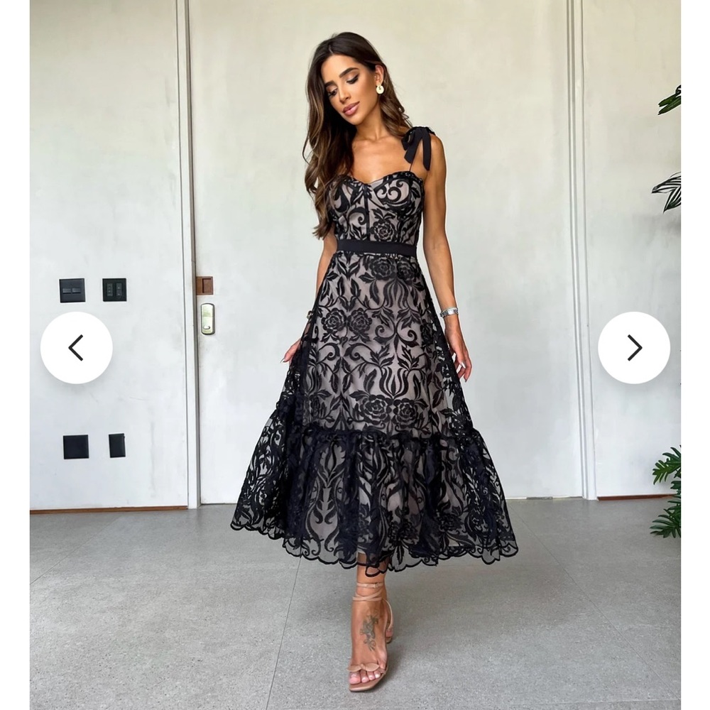 Jeloboutique Dress size large.  Black lace with nude underlay